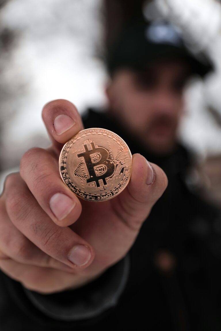 Person holding up Bitcoin