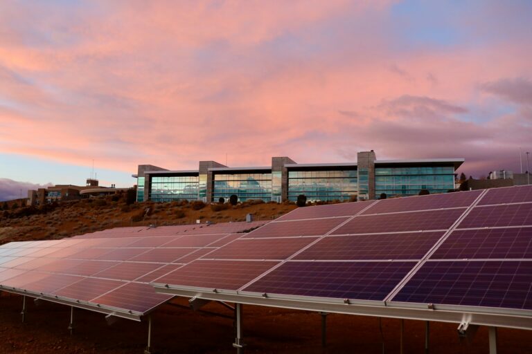 solar panels as energy source alternatives shining during a sunset